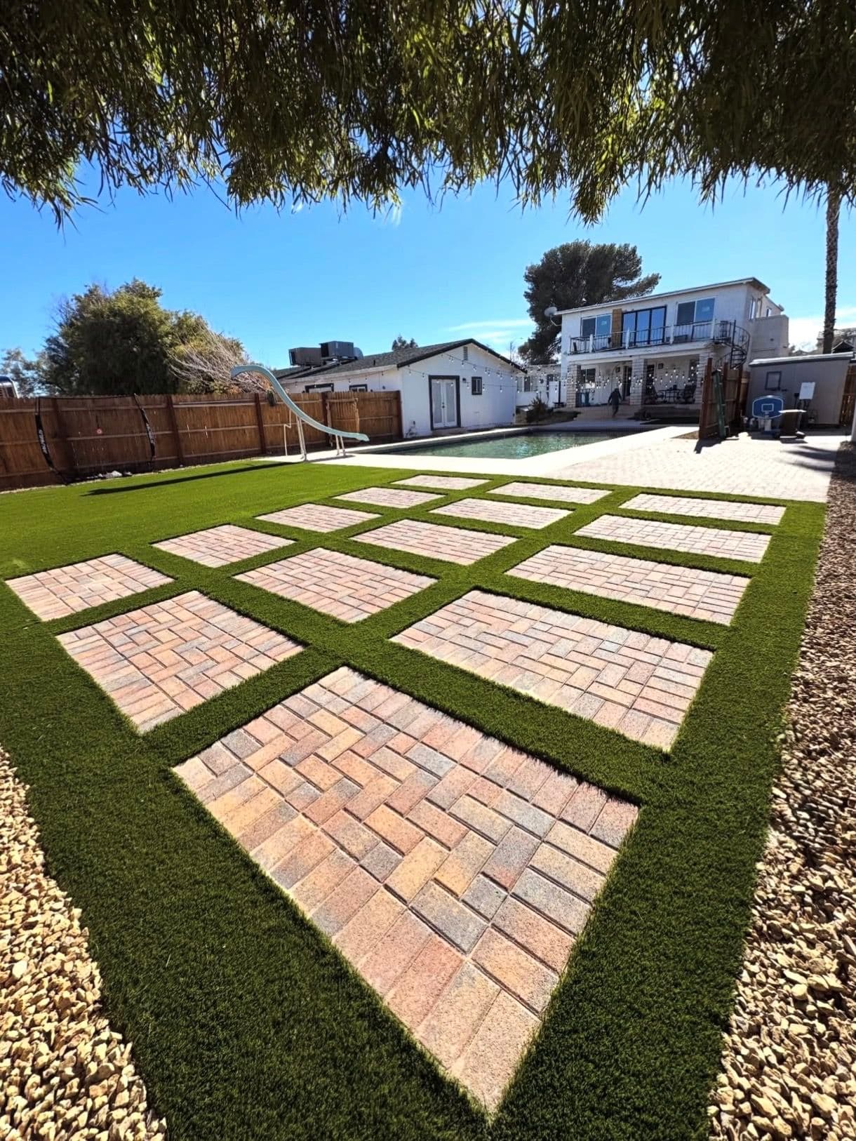 Project Backyard Bliss Achieved with Easy-Care Turf and Custom Pavers image